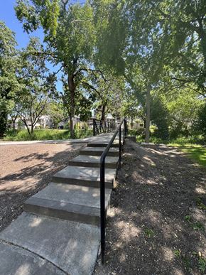 Santa Rosa apartment for rent - A set of stairs with a metal railing on the side going up a hill.