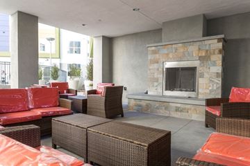 San Diego apartment for rent - a living room with couches and chairs and a fireplace