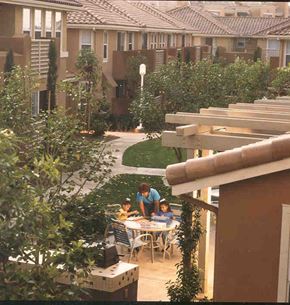 Irvine apartment for rent - a man and two children sitting at a table