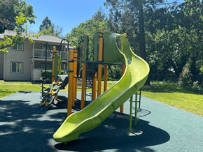 Santa Rosa apartment for rent - A bright yellow slide in a playground.