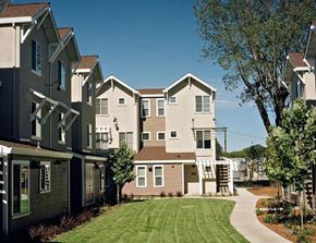 Santa Rosa apartment for rent - a row of houses with a green lawn and trees