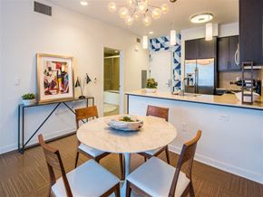 Marina Del Rey apartment for rent - a dining room and kitchen with a table and chairs