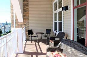 Hazleton apartment for rent - A patio with a table and chairs is shown.