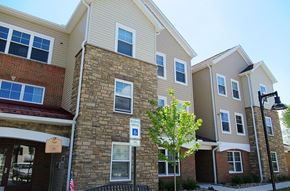 Hazleton apartment for rent - A building with a parking sign in front of it.