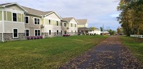 Lake Ariel apartment for rent - A long path with leaves on it leading to a building.