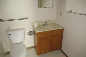 Stoystown apartment for rent - A white toilet sits next to a sink in a small bathroom.