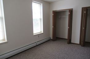 Stoystown apartment for rent - A room with a carpeted floor and a large mirror.