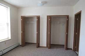 Stoystown apartment for rent - Two open closet doors in a white room.