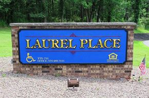 Waymart apartment for rent - A sign that says Laurel Place with a phone number and a house icon.