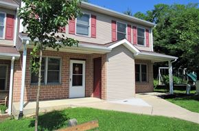 Mcveytown apartment for rent - A house with a red door and a red window.