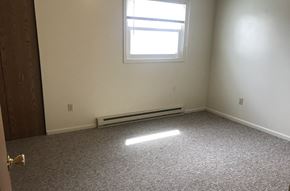 Elysburg apartment for rent - A room with a window and a carpeted floor.