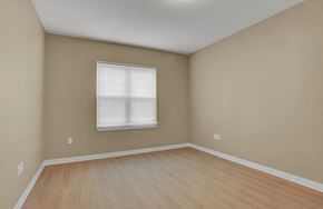 Harrisburg apartment for rent - A room with a window and wooden flooring.