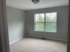Mechanicsburg apartment for rent - A room with a window and carpeted floor.