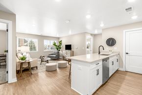 Chesterfield apartment for rent - A modern kitchen with white cabinets and a large island.