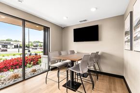 Sterling Heights apartment for rent - a meeting room with a table and chairs and a flat screen tv