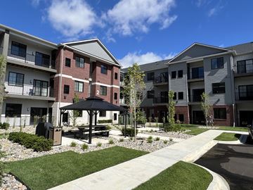 Sterling Heights apartment for rent - Apartment complex with a gazebo in the courtyard.