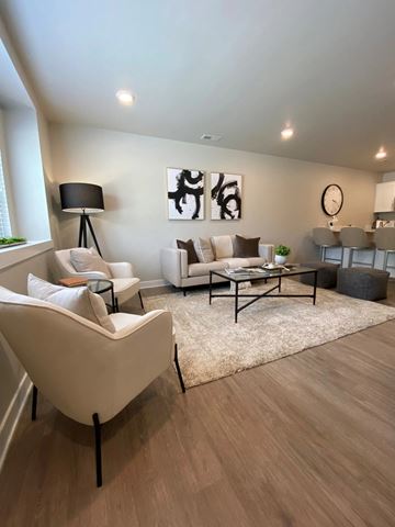 Shelby Township apartment for rent - a living room with white furniture and a rug