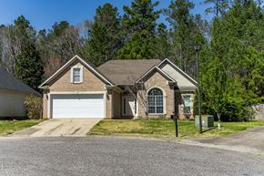 Helena house for rent - a brick house with a white garage door