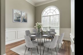 Helena house for rent - a dining room with a table and chairs and a large window
