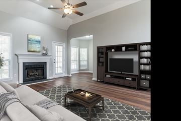 Helena house for rent - a living room with a tv and a fireplace