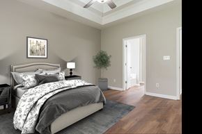 Helena house for rent - a bedroom with a bed and a door to a closet