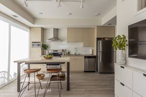 Minneapolis apartment for rent - a kitchen with a table and chairs and a refrigerator