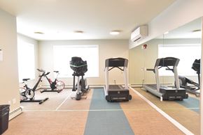 Airdrie apartment for rent - Aqua residential rental apartments fitness center cardio machines