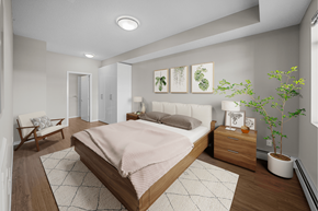 Airdrie apartment for rent - a bedroom with white walls and wood floors and a bed