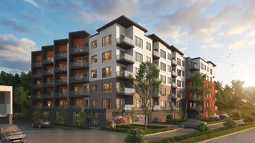 Campbell River apartment for rent - A modern apartment complex with multiple buildings and balconies.