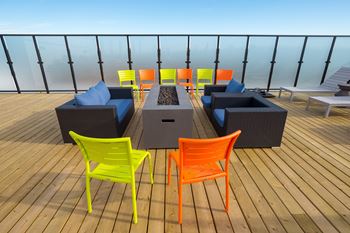 Spectacular rooftop patio with bbq stations, firepits, stylish furniture
