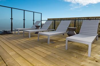 Spectacular rooftop patio with bbq stations, firepits, stylish furniture