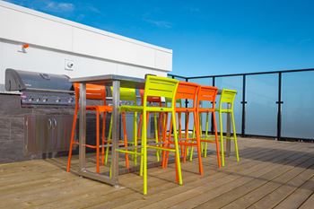 Spectacular rooftop patio with bbq stations, firepits, stylish furniture