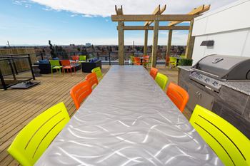 Spectacular rooftop patio with bbq stations, firepits, stylish furniture