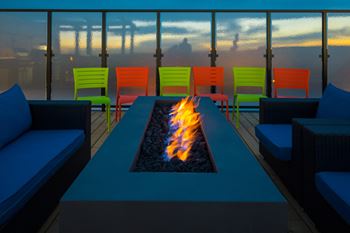 Spectacular rooftop patio with bbq stations, firepits, stylish furniture