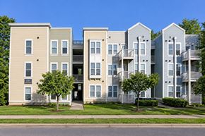Charlotte apartment for rent - Apartment building with a mix of beige and grey exterior walls.