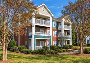 Charlotte apartment for rent - A large two story apartment building with a balcony on the second floor.