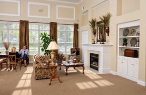 Charlotte apartment for rent - A living room with a fireplace and a large window.