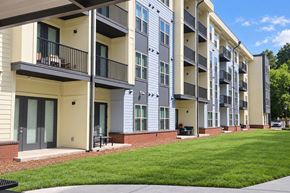 Charlotte apartment for rent - Apartment building with balconies and doors.