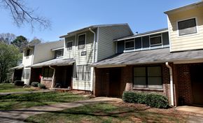 Charlotte apartment for rent - A row of houses with a clear blue sky above them.