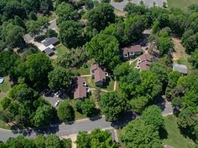 Charlotte apartment for rent - A bird's eye view of a residential area with houses and trees.