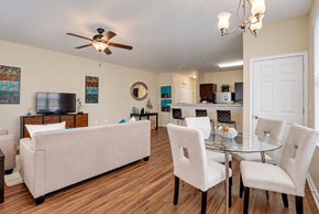 Charlotte apartment for rent - A living room with a couch, chairs, and a television.