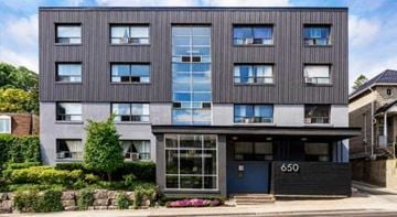 Toronto apartment for rent - A modern building with the number 650 on the front door.