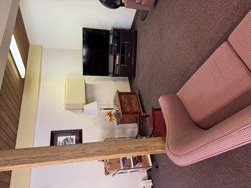 Two Rivers apartment for rent - A living room with a couch and a television.
