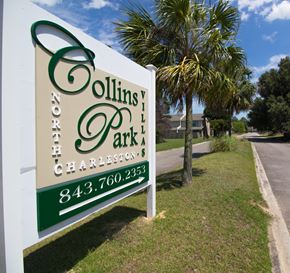 North Charleston apartment for rent - A sign for Collins Park North Charleston stands in front of a tree.