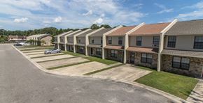North Charleston apartment for rent - A row of houses with a car parked in front of the first house.