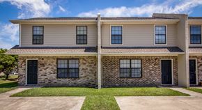 North Charleston apartment for rent - A two-story house with a mix of siding and brick exterior.