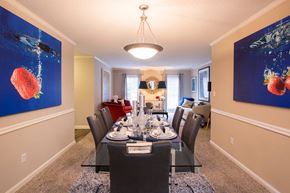 Atlanta apartment for rent - an image of a dining room with a table and chairs