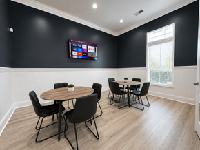 Pensacola apartment for rent - A black and white room with a round table and chairs.