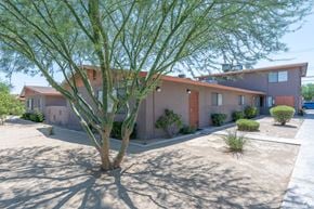 Las Vegas apartment for rent - Apartment building with tree in front.