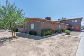 Las Vegas apartment for rent - Apartment building with tree and sidewalk in front.